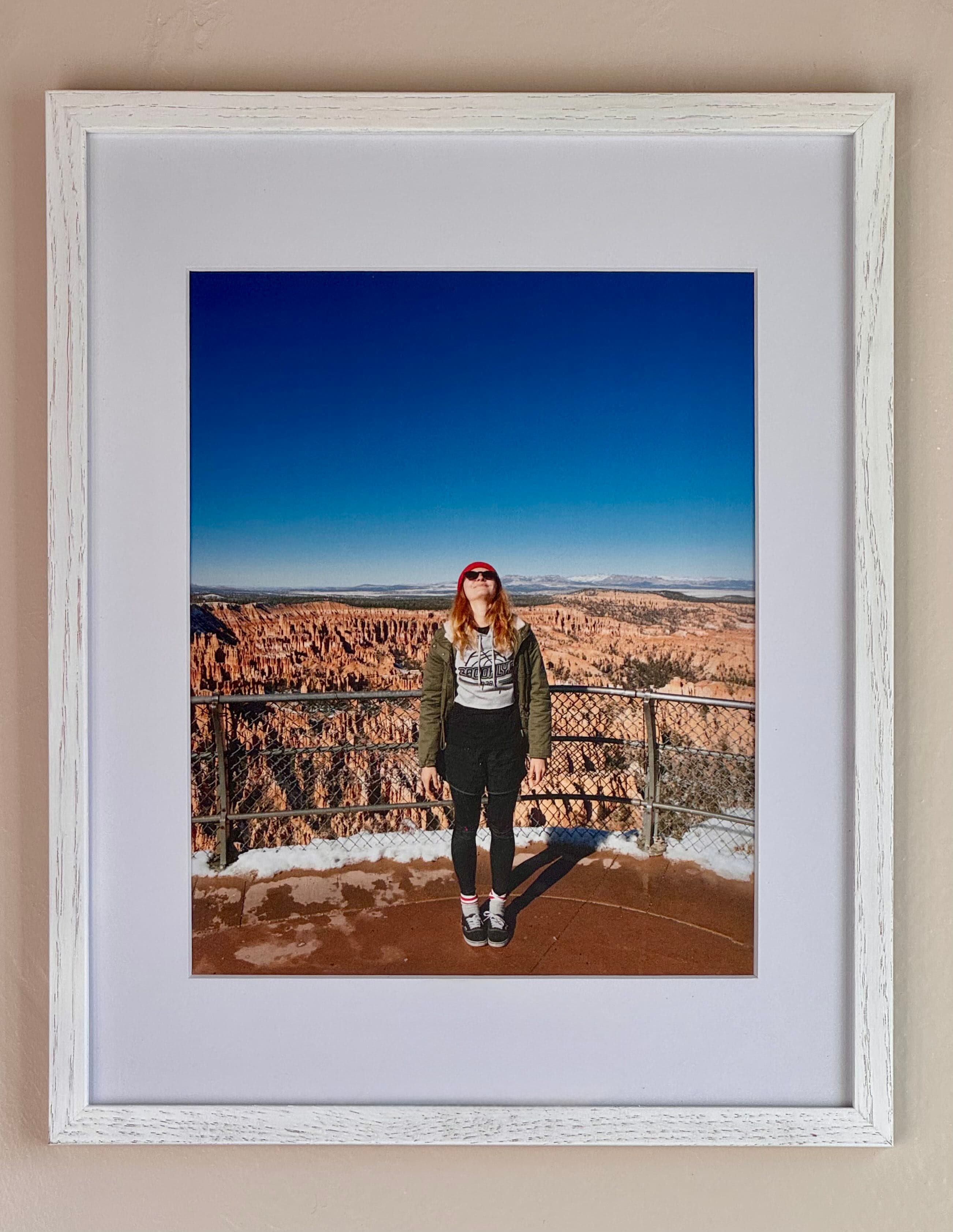 A framed travel photo from Bryce Canyon in a white oak frame