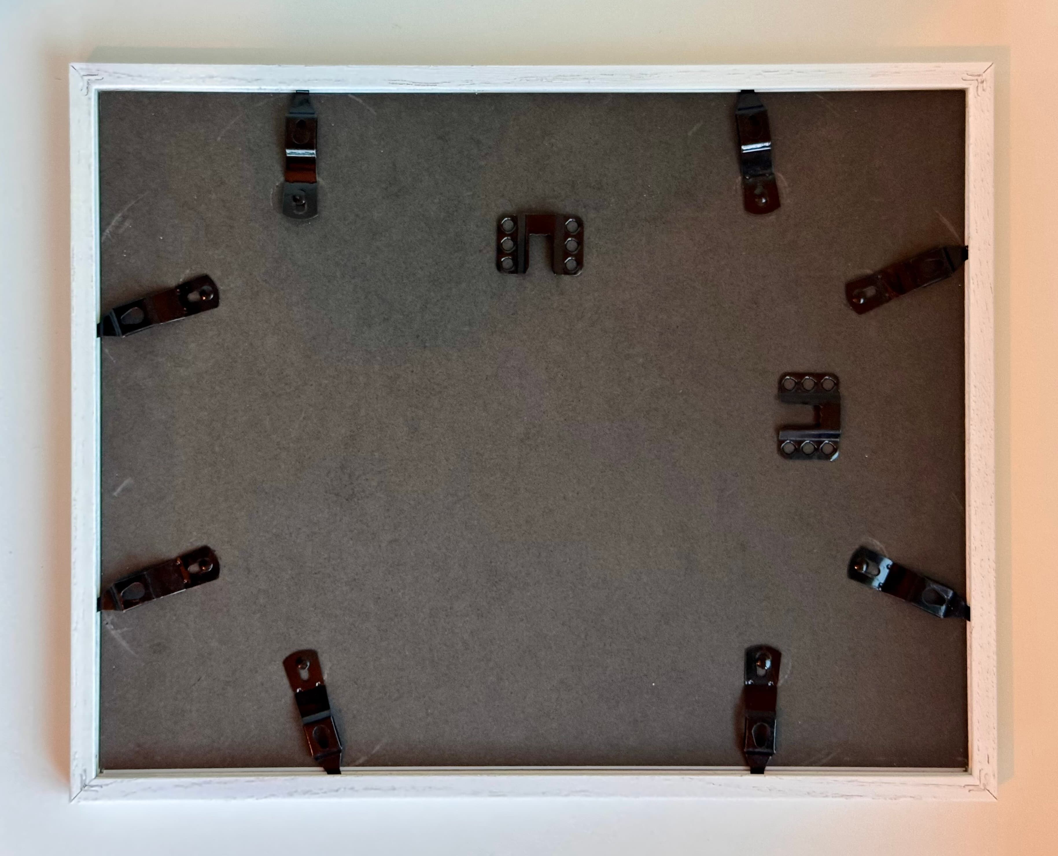 Back of a frame with D-ring hardware installed