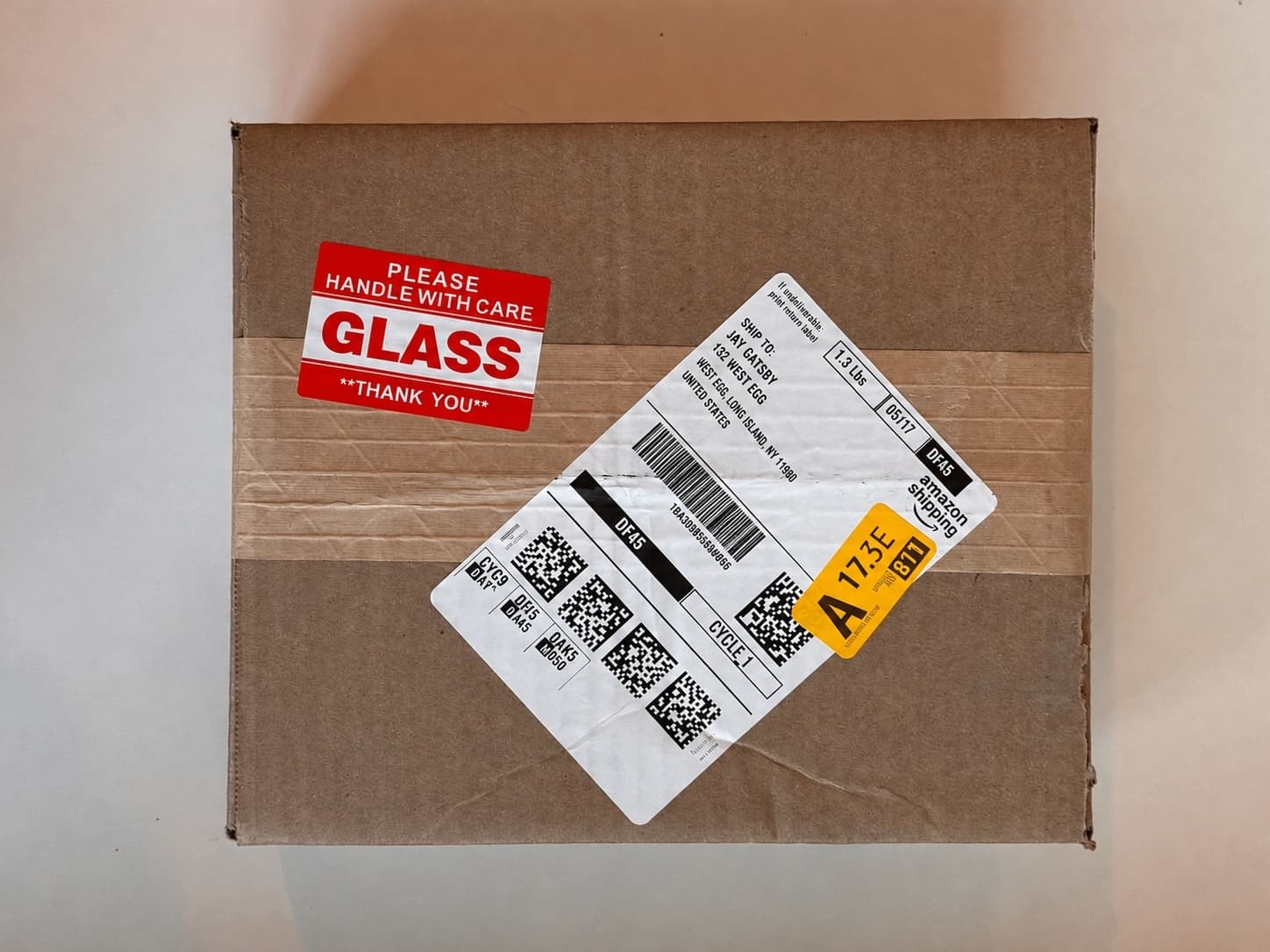 A framelovely box marked GLASS, handle with care