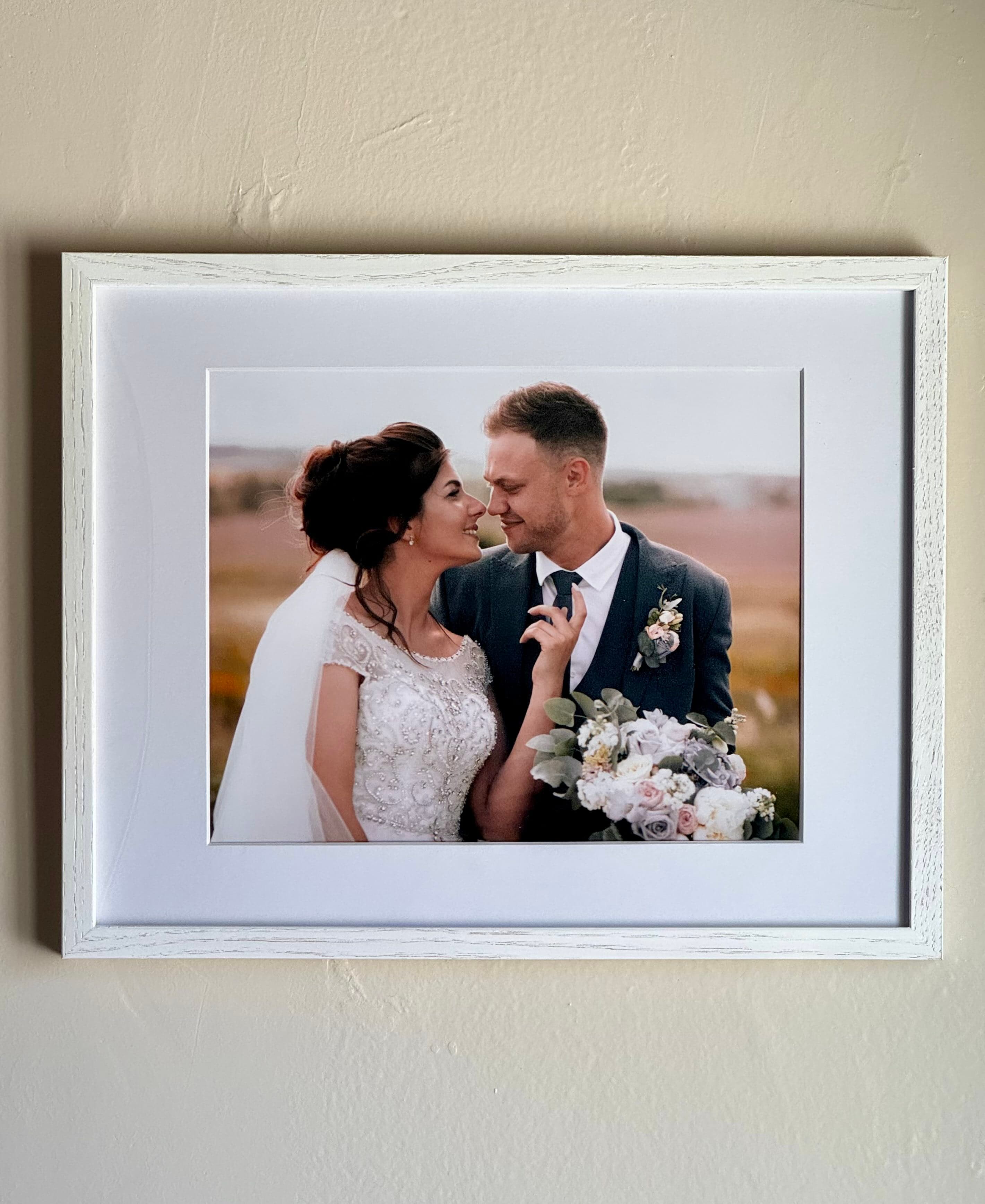 A real framelovely wedding print, framed in white oak on a wall